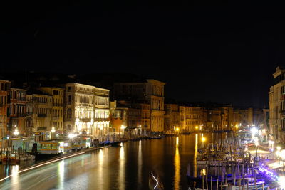 Illuminated buildings in city at night