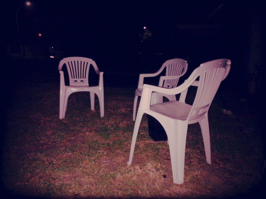 chair, absence, empty, sunlight, shadow, abandoned, night, seat, bench, no people, still life, outdoors, table, relaxation, wood - material, field, high angle view, vignette