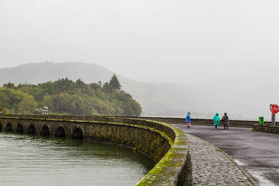 Bridge over river against sky