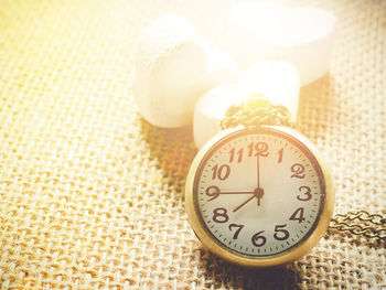 Close-up of clock on table