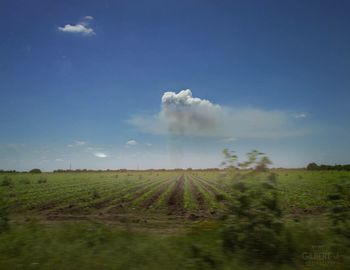 Scenic view of landscape against cloudy sky