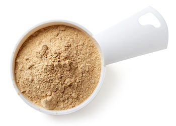 High angle view of bread in bowl against white background