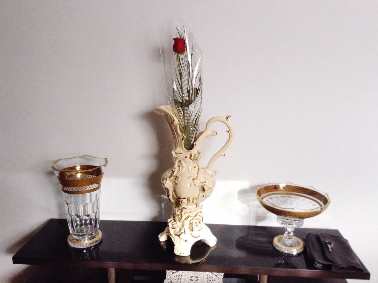 indoors, table, still life, vase, wall - building feature, decoration, glass - material, close-up, hanging, home interior, studio shot, decor, flower, copy space, lighting equipment, no people, wineglass, single object, art and craft, white background