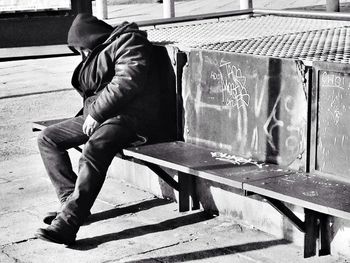 Full length of young woman on wall
