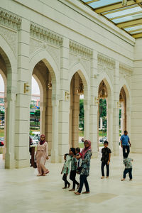 Group of people walking in building