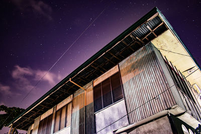 High section of building against sky at night