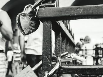 Close-up of padlocks on railing