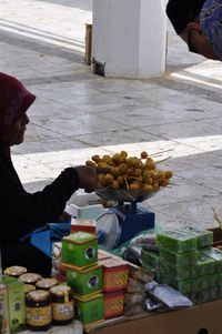 High angle view of man preparing food on table