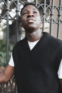 Young african american man outdoor, street portrait. fall or spring season