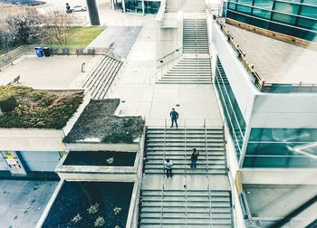 High angle view of people walking on stairs