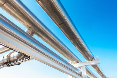 Low angle view of modern building against clear blue sky