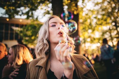 Portrait of beautiful woman at bubbles