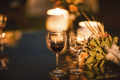 Close-up of wineglasses on table