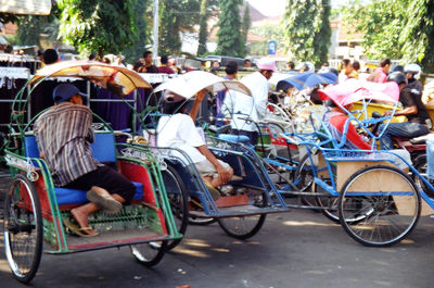People on motorcycle in city