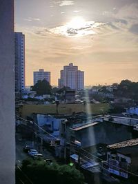 High angle view of buildings against sky during sunset