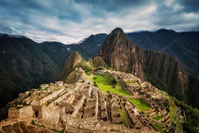 View of mountain range against cloudy sky