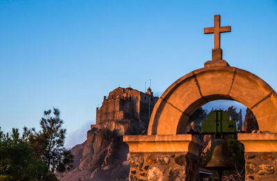 Bell by stavrovouni monastery against clear blue sky