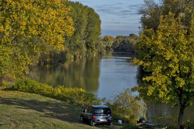 Scenic view of lake by trees during autumn