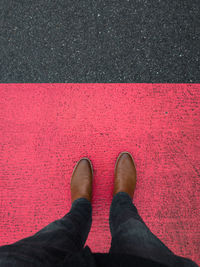 Low section of person standing on street