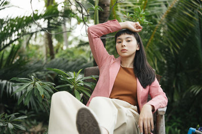 Portrait of young businesswoman sitting outdoors