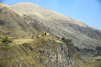 Scenic view of landscape and mountains against sky