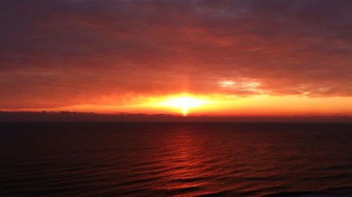 Scenic view of sea at sunset