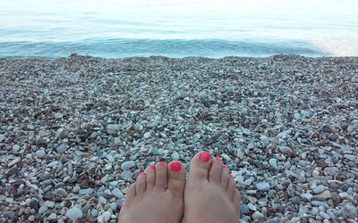 Low section of woman legs on beach