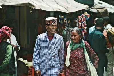 People at market stall