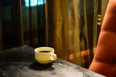 Close-up of coffee cup on table