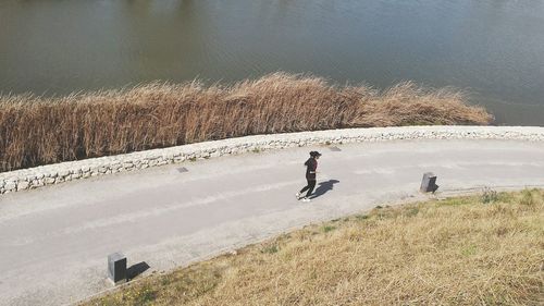 Woman jumping on shore
