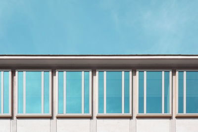 Close-up of built structure against blue sky