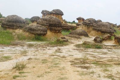 Rock formations in desert against sky