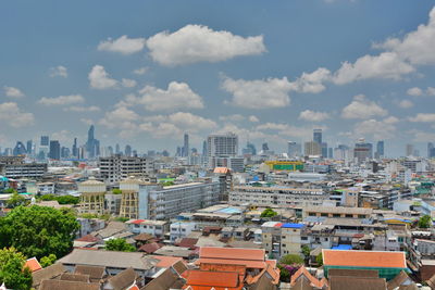 High angle view of buildings in city against sky