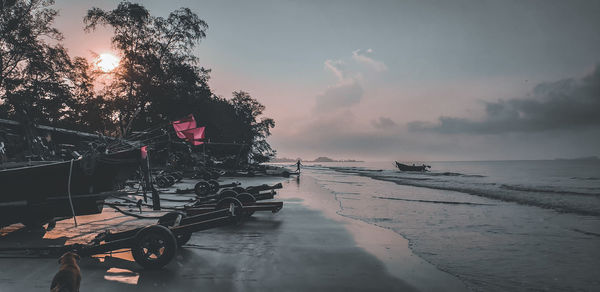 Scenic view of beach against sky during sunset