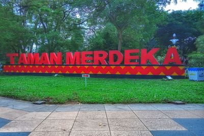 Information sign on street in park