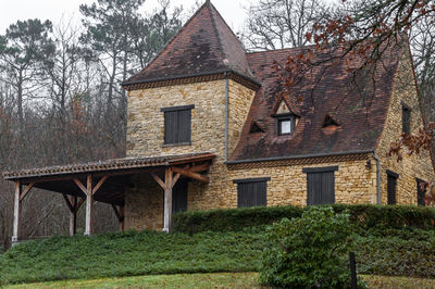 Exterior of old house by building