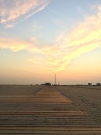 Scenic view of land against sky during sunset