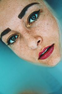 Directly above portrait of woman in water