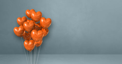 Directly above shot of red balloons on table against wall