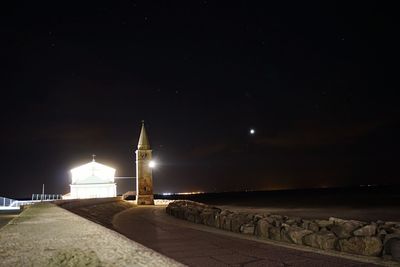 Illuminated street lights at night