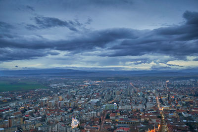 High angle view of buildings in city against sky