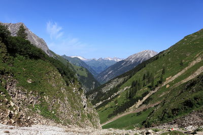 Countryside landscape against blue sky