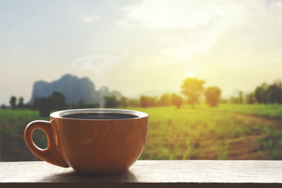 Coffee cup against sky