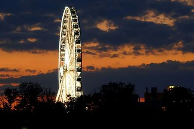 Low angle view of ferris wheel against sky