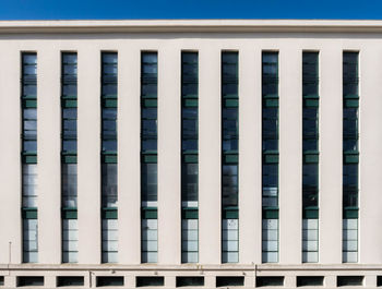 Close-up of building against blue sky