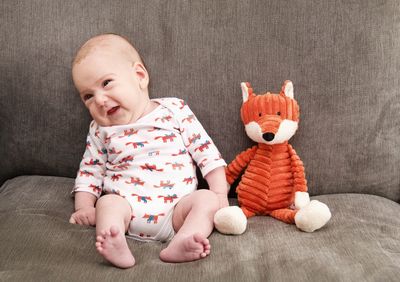 Cute baby girl with toy toys