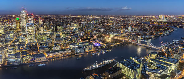 High angle view of illuminated buildings in city at night