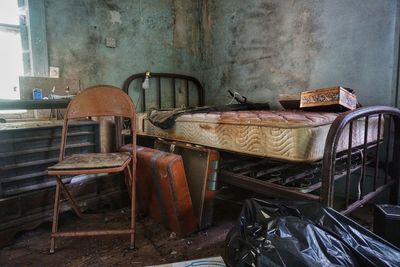 Empty chairs and tables in abandoned room