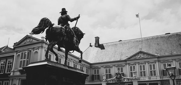 Low angle view of statue against sky