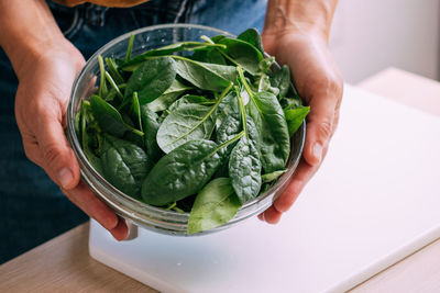 Cropped hand of man holding food